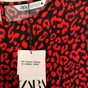 Flowy rounded neck dress with below elbow sleeves